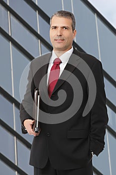 Businessman smilling with notebook