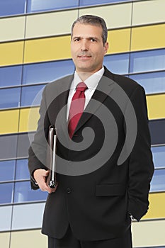 Businessman smilling with notebook