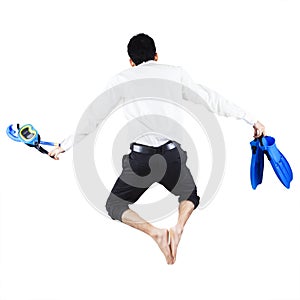 Businessman with snorkeling gear jumping