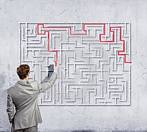 Businessman solving labyrinth problem