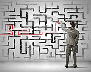 Businessman solving labyrinth problem