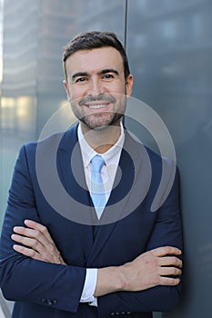 Businessman with a sophisticated look crossing his arms