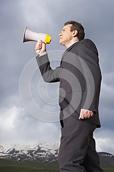 Businessman Speaking Through Megaphone