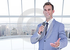 Businessman speaking on microphone
