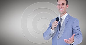 Businessman speaking on microphone