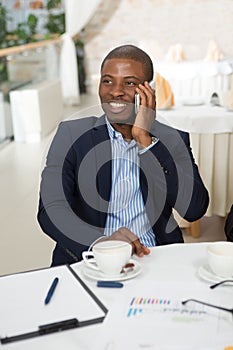 Businessman speaking over mobile phone