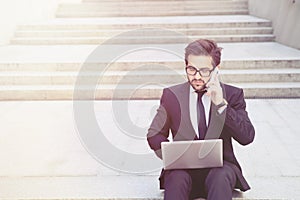 Businessman speaking over mobile phone