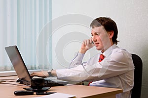 Businessman speaks by phone