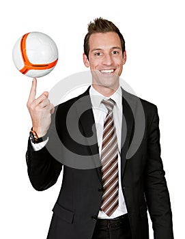 Businessman spinning soccer ball