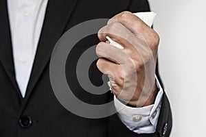 Businessman squeeze paper, hand close-up