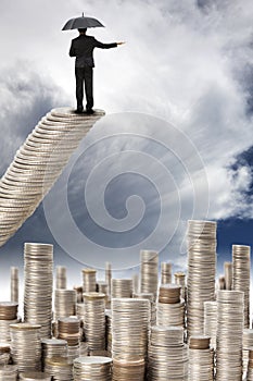 Businessman stand on the money stair