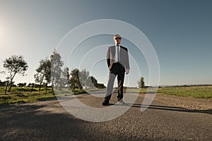 Businessman stand on road
