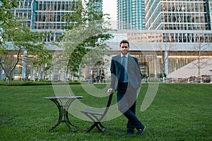 Businessman stand up and night city background. Boss in open business center. Successful business man outside.