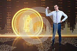 Businessman standing against bitcoin symbol on digital background