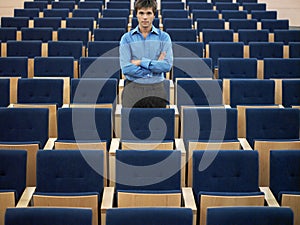 Businessman Standing In Auditorium