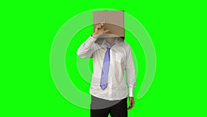 Businessman standing with box over his head