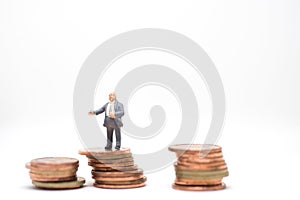 Businessman standing on coin