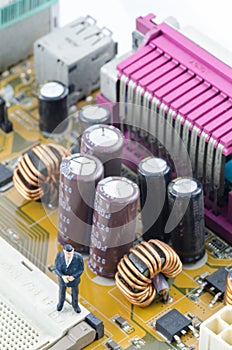 Businessman standing on the Computer motherboard