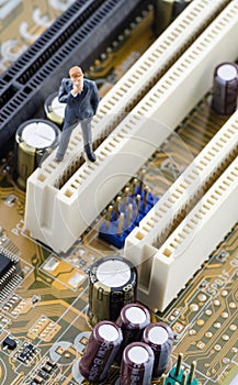 Businessman standing on the Computer motherboard