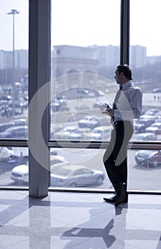 Businessman standing in corridor