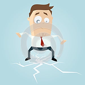 Businessman standing on cracking ice photo