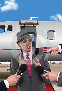 Businessman standing in front of corporate jet