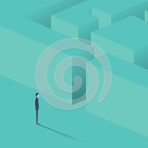 Businessman standing in front of maze. Business concept strategy, solution finding.