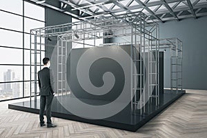 Businessman standing in gallery interior