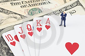 Businessman standing on the gamble card with US dollar