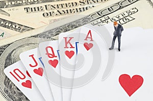 Businessman standing on the gamble card with US dollar