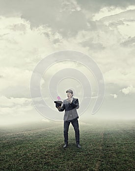 Businessman Standing Growing Flower