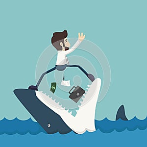 Businessman standing on Jaws of shark