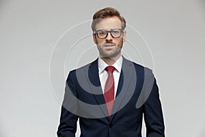 Businessman standing and looking at camera fearful