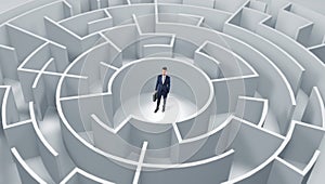 Businessman standing in a middle of a round maze