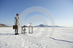 Businessman Standing at Mobile Office Desk Outdoors