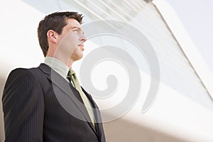 Businessman standing outside office