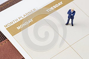 Businessman standing on the planner book