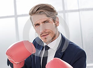 Businessman standing posture with boxing gloves