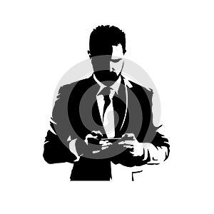 Businessman standing and texting with mobile phone. Isolated vector silhouette, ink drawing. Text messaging photo