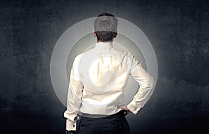 Businessman standing and thinking