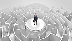 Businessman standing on the top of a maze