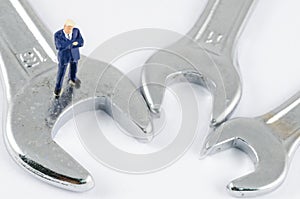 Businessman standing on the wrench, Problem solving co