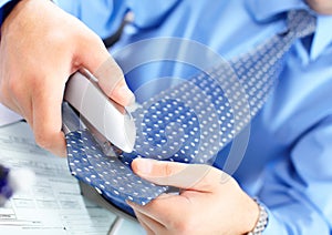 Businessman stapling the tie