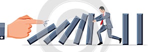 Businessman stopping domino effect.