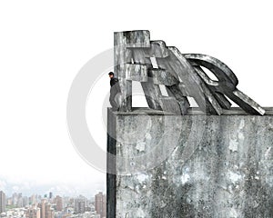 Businessman stopping domino of red fear word falling