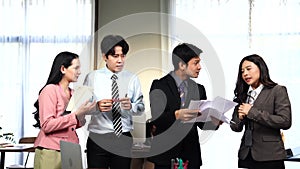 Businessman stressed and overworked yelling in office. Group of businesspeople seeing businessman blaming his colleague in meeting