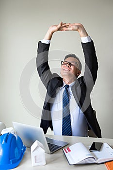 businessman stretch hands to relief back pain