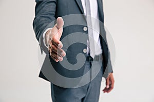 Businessman stretching hand for handshake