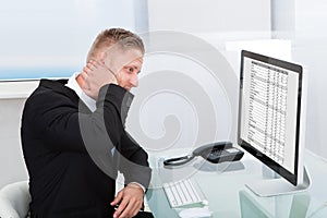 Businessman studying an online spreadsheet