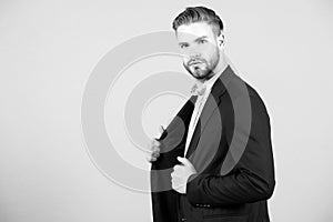 Businessman with stylish hair in formal suit. Man with beard and mustache on unshaven face. Beard grooming and hair care